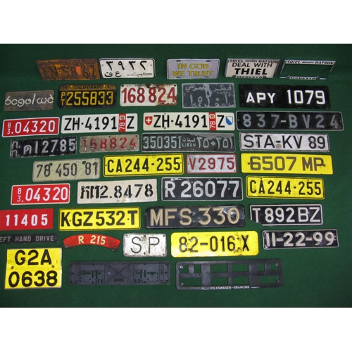 35 - Large quantity of various design British and foreign vehicle number plates for display purposes only