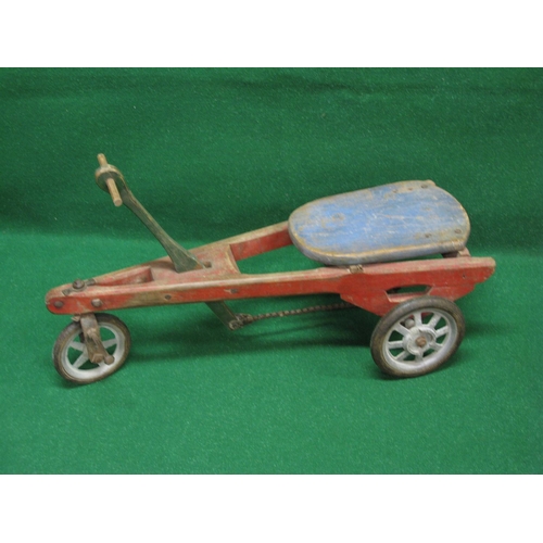 164 - Possibly French wooden hand propelled three wheel trike with foot steering and solid tyre metal whee... 