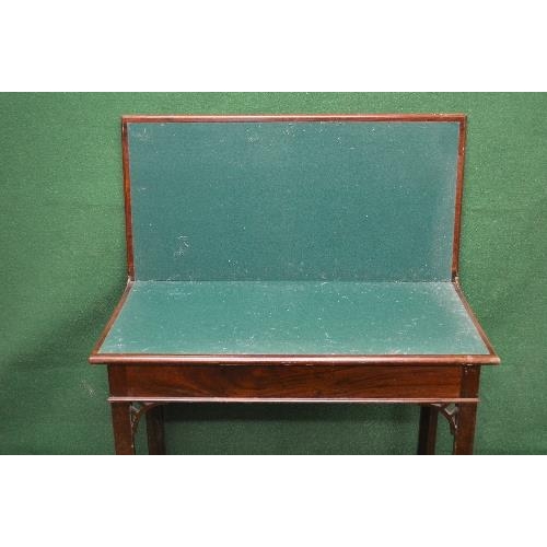 103 - Mahogany fold over tea table having rectangular top opening to reveal green playing surface, standin... 