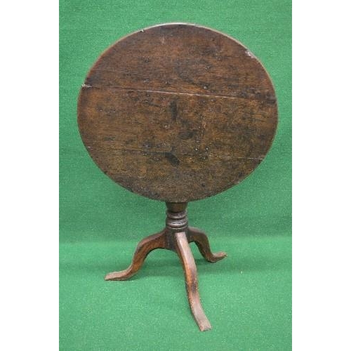 11 - Circular oak tip top occasional table the top supported on a turned column, standing on a tripod bas... 