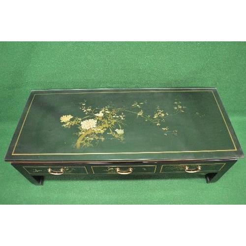 13 - 20th century lacquered chinoiserie style coffee table having protective glass top over three drawers... 