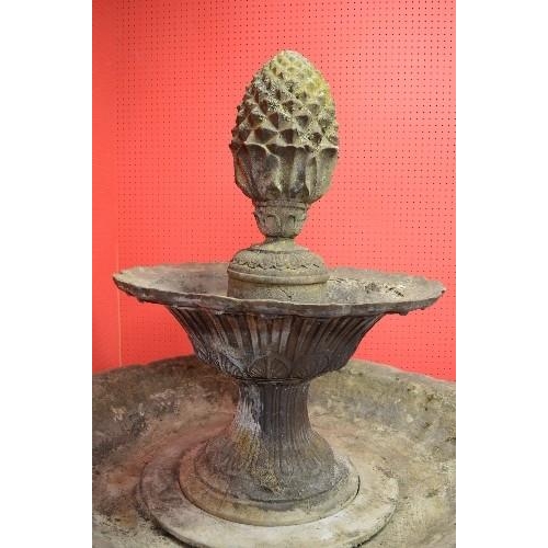 153 - Fibreglass and cement mix two tier water fountain having pineapple formed top over two graduated tie... 