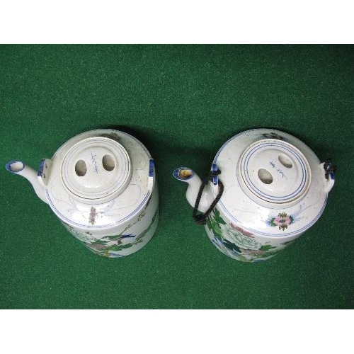 211 - Pair of large Oriental teapots having floral decoration with birds and cord handle (one handle missi... 