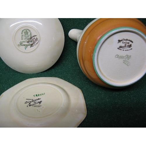 212 - Collection of Clarice Cliff Bizarre Crocus pattern tea and dinner ware to include: two lidded teapot... 