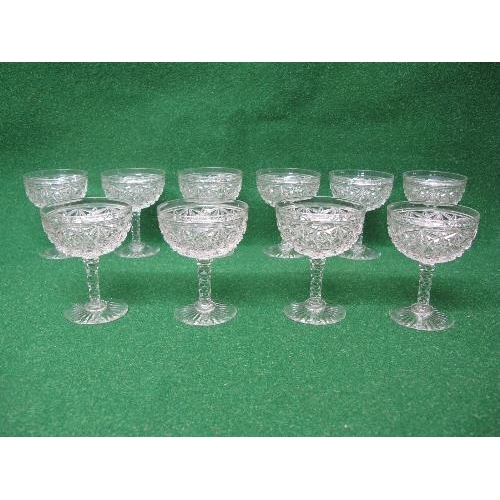 224 - Set of ten Tudor Crystal champagne coupes having cut decorated bowls supported on cut stems and star... 