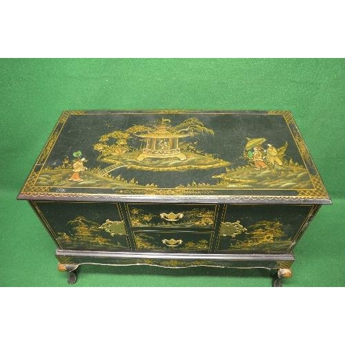 28 - Chinoiserie decorated side cabinet the top having raised decoration of figures and pagoda over two c... 