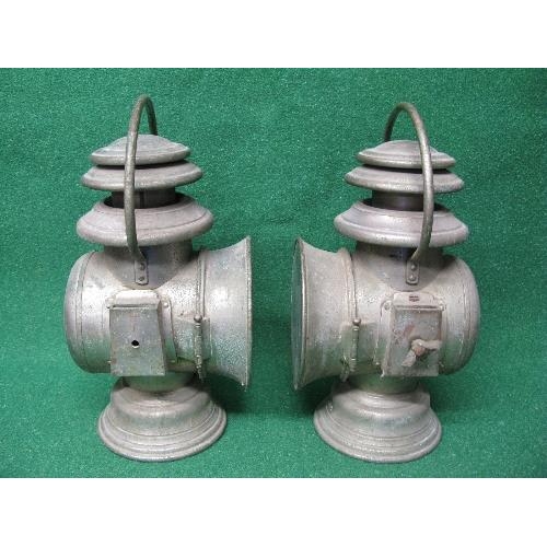 280 - Two French paraffin lamps with side slot mounts and top handles, burners are removed through the bas... 