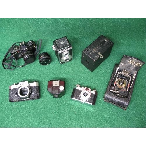 296 - Group of seven cameras to include: Yashica TL-Electro, Halina Perfect, Konica Autoreflex TC, Kodak N... 