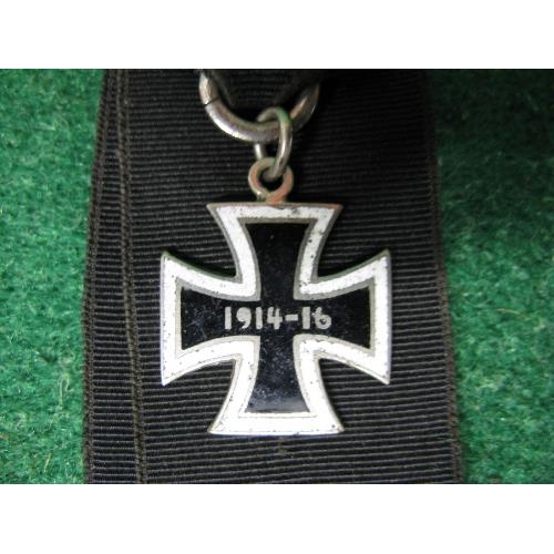 316 - Unusual German torpedo medal having an enamelled cross with white border and black centre, dated 191... 