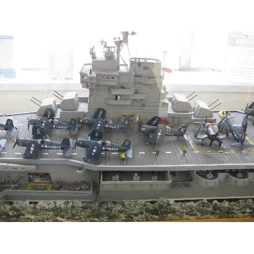 327 - Large bespoke detailed model of a WWII American wooden decked light aircraft carrier with twenty sev... 