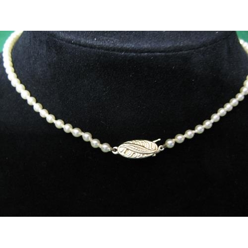 334 - Cultured pearl necklace formed of single row of uniform sized pearls having 9ct white gold clasp set... 