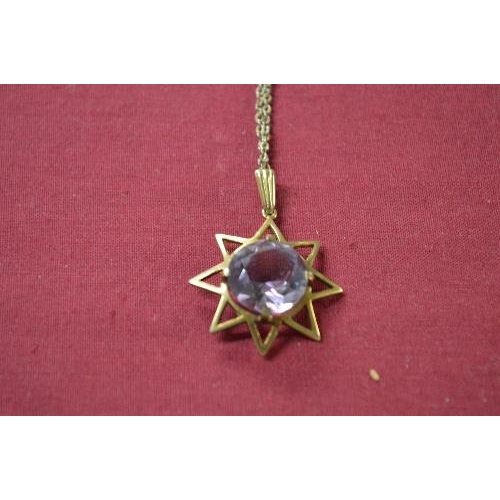 343 - 9ct gold and Amethyst single stone pendant in a star shaped design, claw set with a circular cut Ame... 