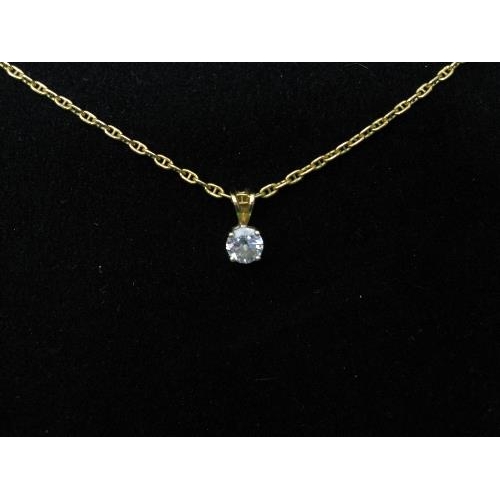 347 - 18ct gold pendant set with single diamond in a claw setting on a 9ct oval link chain - 20.25