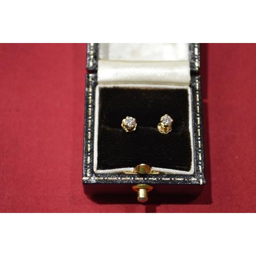 349 - Pair of gold and Diamond single stone ear studs each claw set with a circular cut Diamond, the backs... 