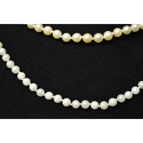 357 - Two pearl necklaces formed of single rows of uniform sized pearls and having 9ct gold clasps -  20.5... 