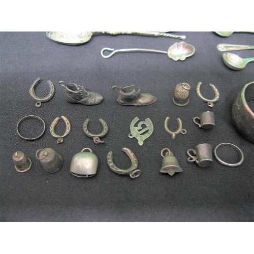 388 - Group of small silver and other items to include: sugar tongs, spoons, charms and bangle together wi... 