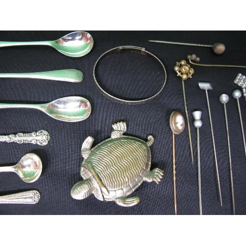 388 - Group of small silver and other items to include: sugar tongs, spoons, charms and bangle together wi... 