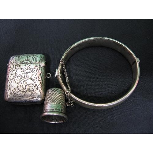 389 - Silver bangle together with a silver vesta case and silver thimble