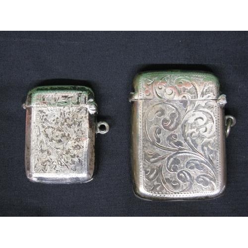 391 - Two silver engraved vesta cases