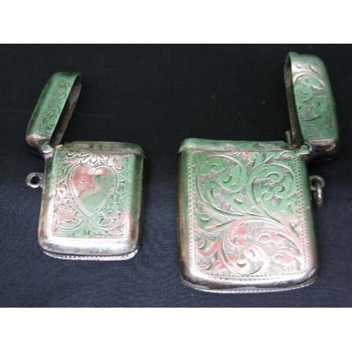 391 - Two silver engraved vesta cases