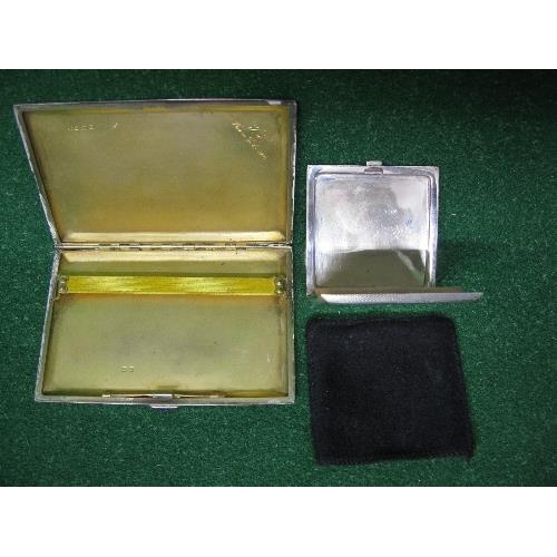 399 - Silver compact having engine turned decoration together with a silver cigarette case also with engin... 