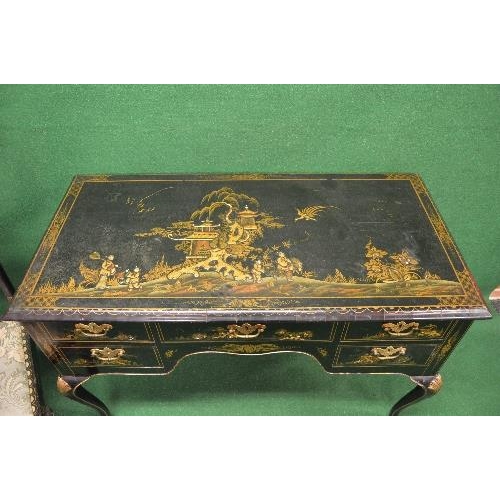 47 - Black lacquered chinoiserie decorated desk the top having raised decoration of figures, tree and pag... 