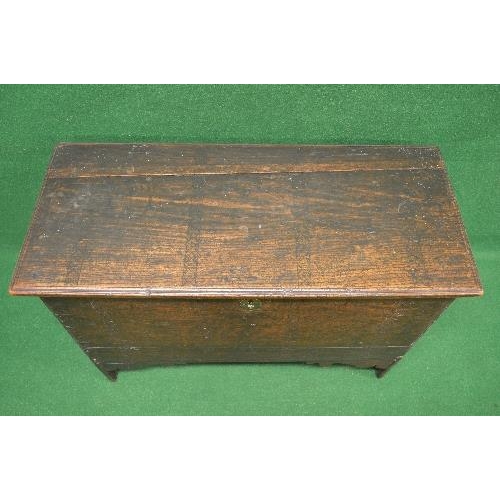 48 - Oak coffer the top lifting to reveal storage space and having light carved decoration, standing on V... 