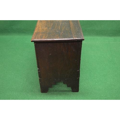 48 - Oak coffer the top lifting to reveal storage space and having light carved decoration, standing on V... 