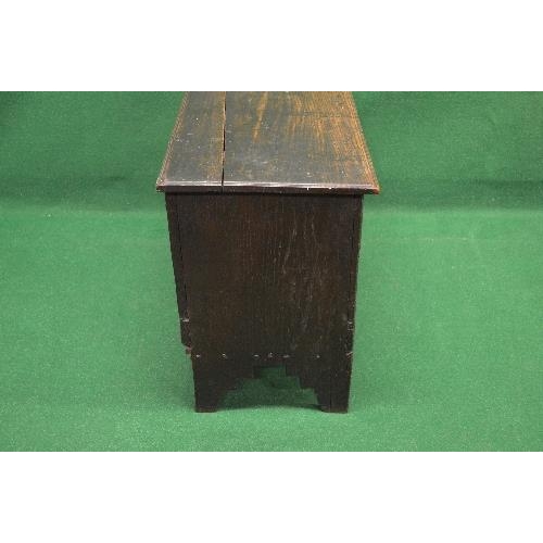 48 - Oak coffer the top lifting to reveal storage space and having light carved decoration, standing on V... 