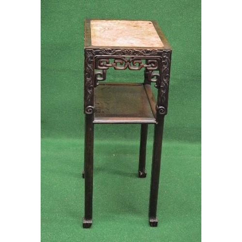 51 - Oriental hardwood two tier plantstand having rectangular top with marble insert over a pierced friez... 