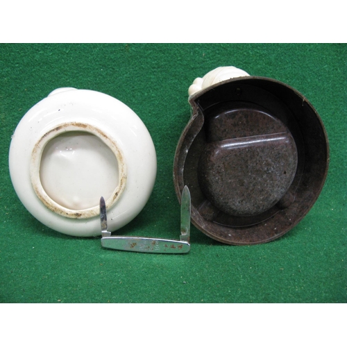 134 - Two ashtrays with Bibendum's, of stoneware and bakelite construction - average 5.5