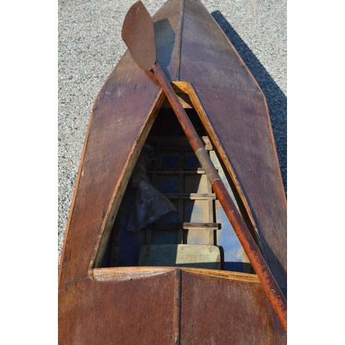 253 - Plywood and canvas canoe with wooden paddle - 134