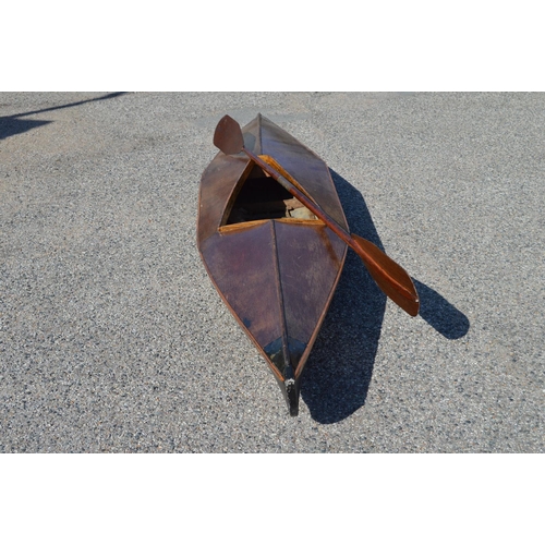 253 - Plywood and canvas canoe with wooden paddle - 134