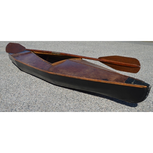 253 - Plywood and canvas canoe with wooden paddle - 134