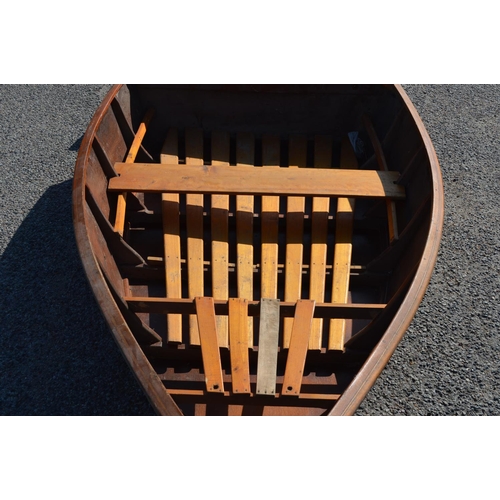 254 - An all wood portable dinghy in two parts, the larger bow section goes on the roof rack, the stern in... 