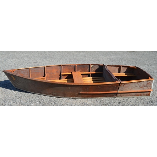 254 - An all wood portable dinghy in two parts, the larger bow section goes on the roof rack, the stern in... 