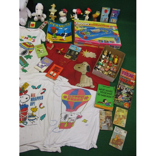 307 - Collection of Snoopy items to include: figures, lamp, t-shirts etc, paperbacks, boxed road racing ga... 