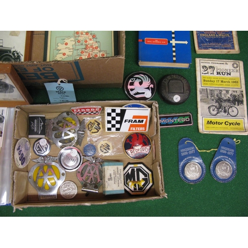 31 - Two boxes of mixed automobilia and ephemera to include: badges, books, black and white pictures, map... 