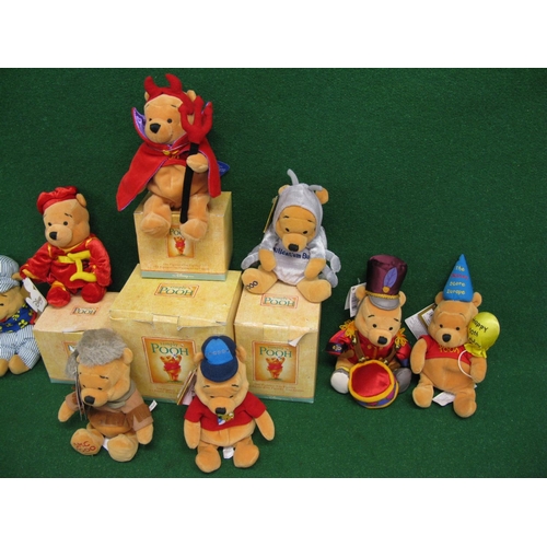 312 - Nine Disney Beanie Pooh Bears in various outfits - average height 7