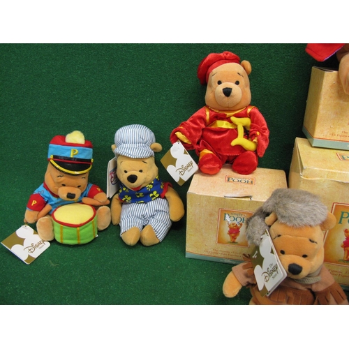 312 - Nine Disney Beanie Pooh Bears in various outfits - average height 7