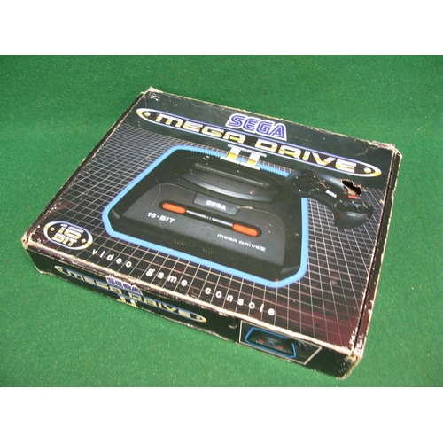 319 - Boxed Sega Mega Drive II from the early 1990's together with a James Pond II cartridge (untested)