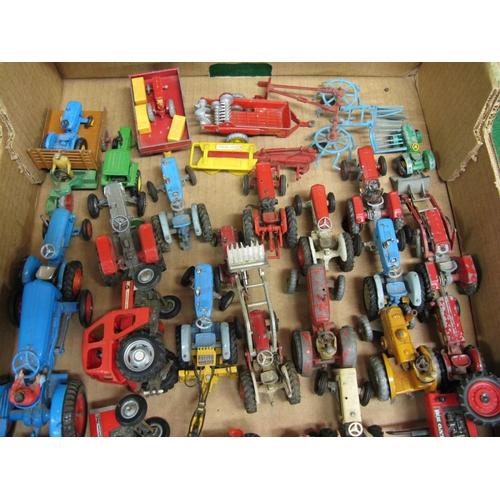 343 - Box of approx thirty seven loose playworn tractor and implement models of various scales by Dinky, B... 