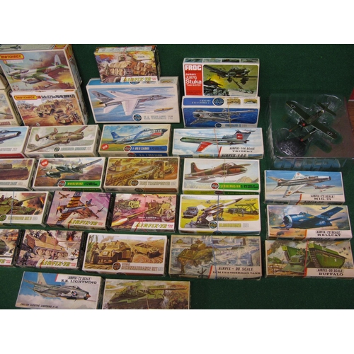 377 - Thirty three boxed unmade plastic kits of aircraft and military vehicles produced by Airfix, Matchbo... 