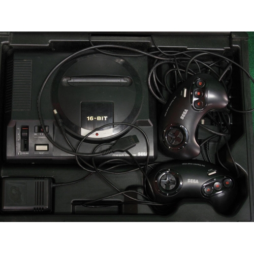 407 - Sega 16-bit Megadrive and two Megadrive control pads contained in original plastic carrying case wit... 