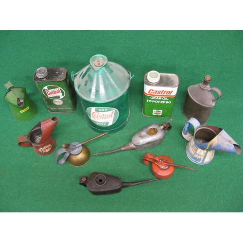 42 - Eleven assorted oil containers, cans and pourers for: Castrol, Esso, Shell and Halfords etc