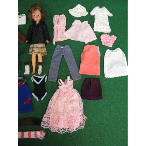 422 - Made in England Sindy doll with a selection of clothing and footwear (in the white case)