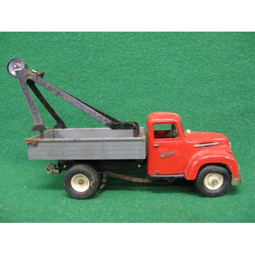 438 - Loft find Schuco Construction clockwork tinplate and plastic tipper truck with removable rear crane ... 