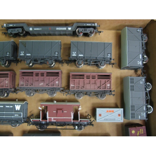 476 - Twenty six loose playworn OO scale Bachmann and Dapol etc Goods wagons and Guards vans together with... 