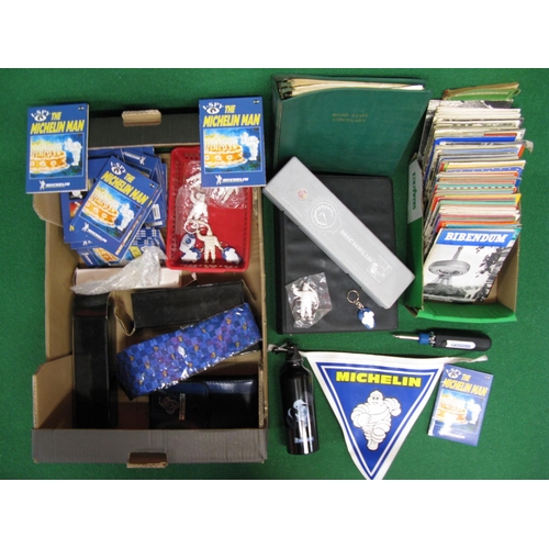 73 - Two boxes of assorted Michelin branded collectables to include: water bottles, keyrings, I Spy books... 