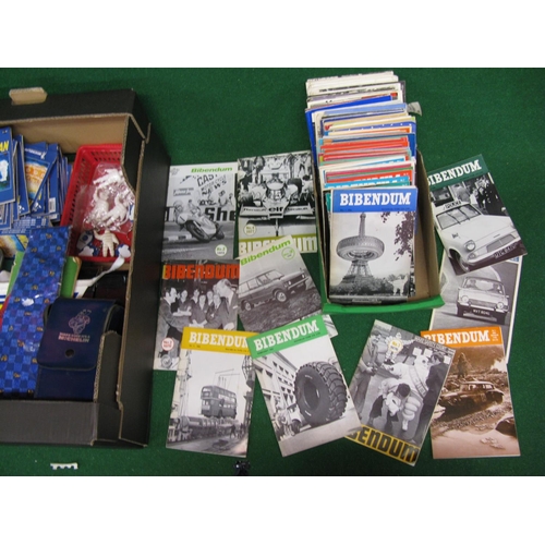 73 - Two boxes of assorted Michelin branded collectables to include: water bottles, keyrings, I Spy books... 